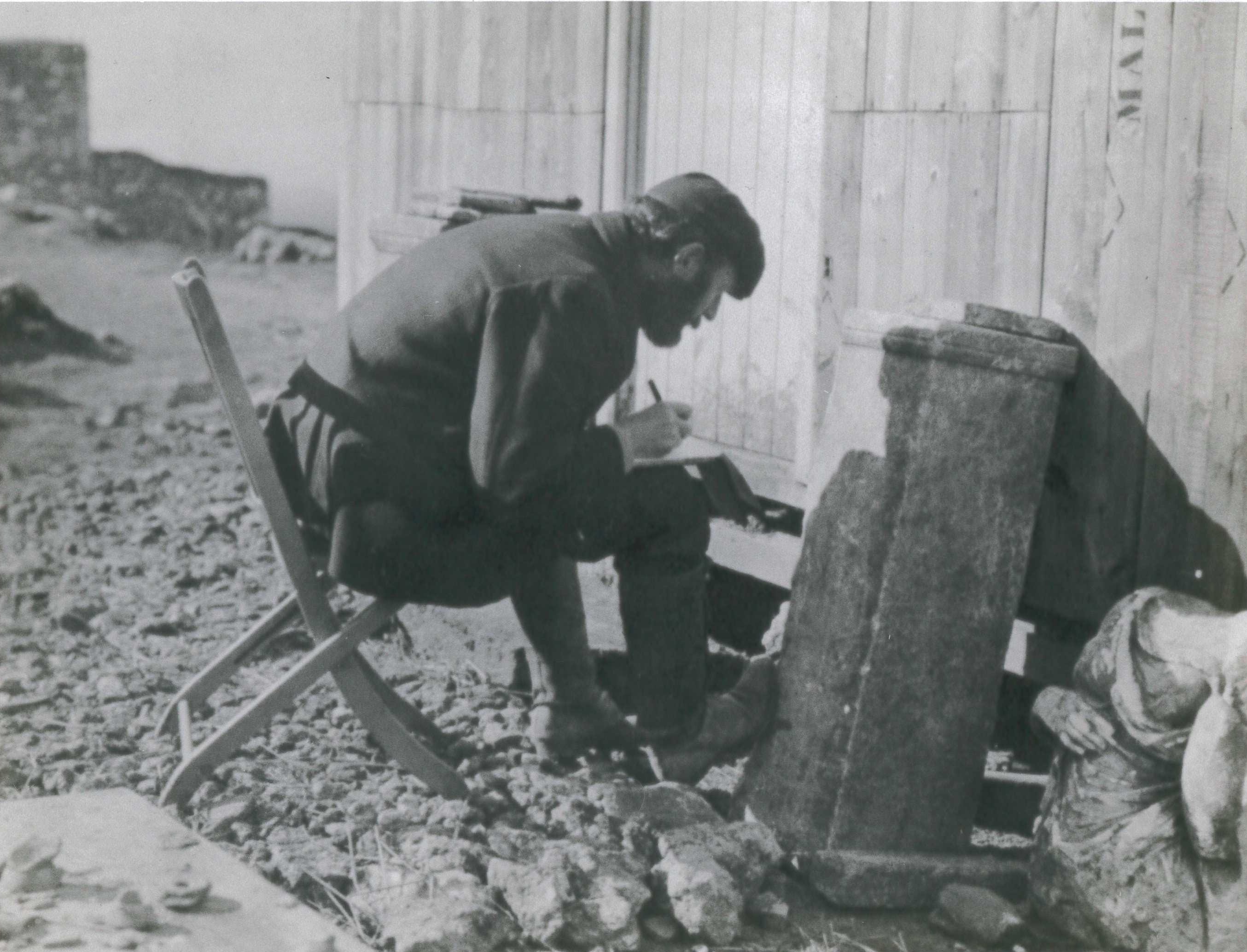 Herbert DeCou hard at work on the site’s epigraphy, Cyrene, 1911