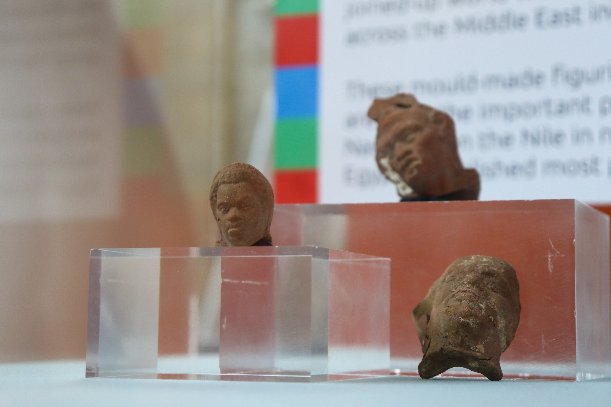 Three terracotta figurines (heads only) identified as figures with African origins