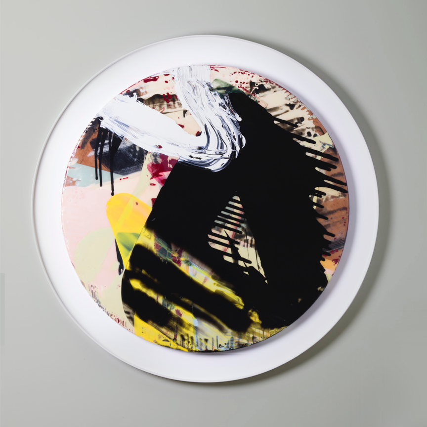a circular abstract artwork with layered coloured smears of resin