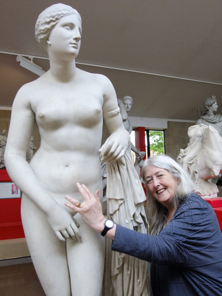 Mary Beard reaches out to statue of a naked woman