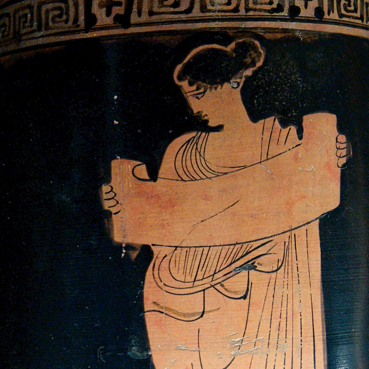 Musa reading a volumen (scroll), at the left an open chest. Attic red-figure lekythos, ca. 435-425 BC. From Boeotia