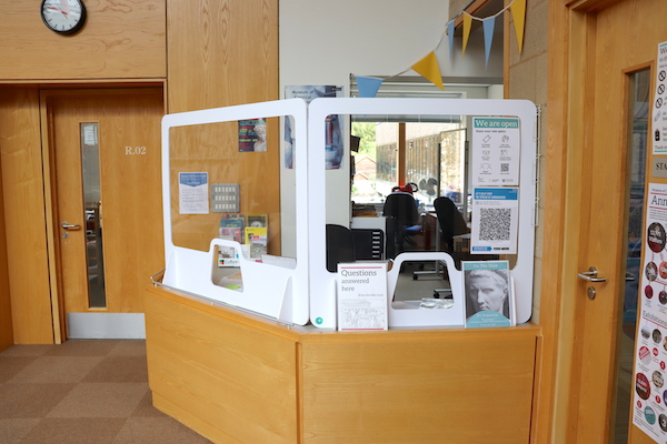 museum front desk fitted with perspex screens