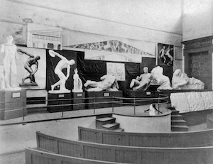 black and white image of casts on a lecture theatre stage