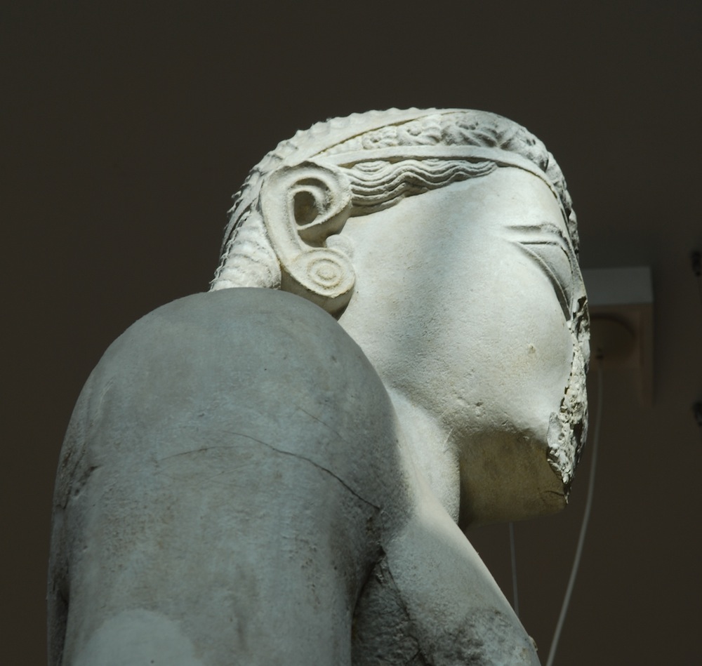 head of statue from side with braided hairstyle