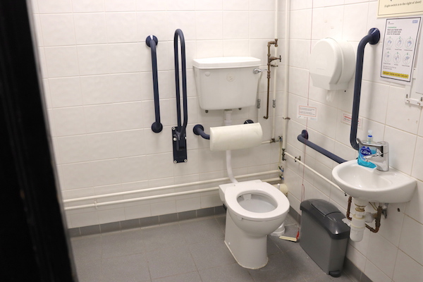 disabled toilet with larger transfer space and emergency pull cord