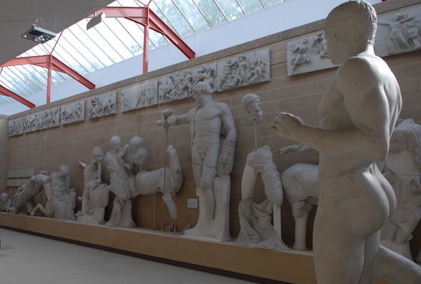 pediment with centaurs fighting men and Apollo standing tall in middle