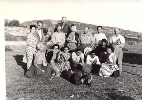 black and white photograph of a group of men and women of different ages and ethnicities