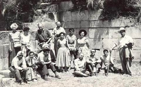 black and white photograph of a group of men and women, including local Turksih guides