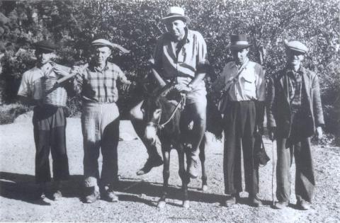 black and white photograph of George Bean on a donkey with four local Turkish guides