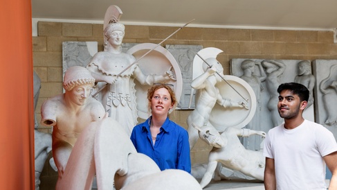 Students looking at statues in the Museum of Classical Archaeology