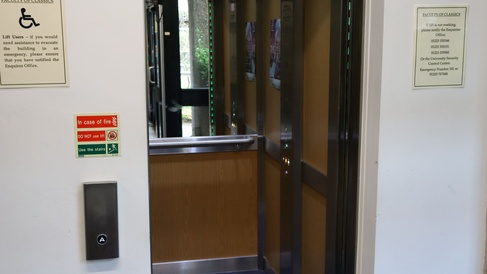 lift with doors open to see mirrored inside
