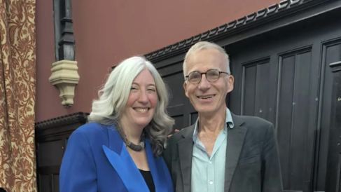 Professors Jo Quinn (left in blue) and Robin Osborne