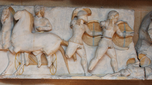 Frieze of men fighting