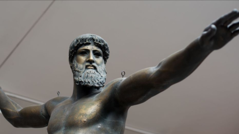 plaster cast of bronze Poseidon with a beard, standing with arms outstretched