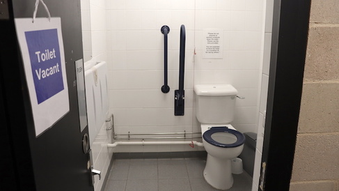 The disabled and gender neutral toilet in the main entrance foyer is compact and is fitted with baby-changing facilities