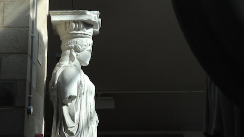 statue of a caryatid in the sunshine