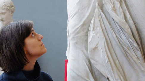 Rosy looks up at the Nike of Samothrace