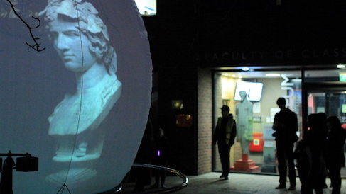 A big, lit up globe outside the entrance of the museum for an event