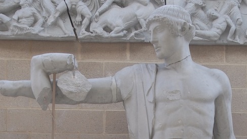 Figure of Apollo, hair in short turned up style, pointing arm to left and looking to left