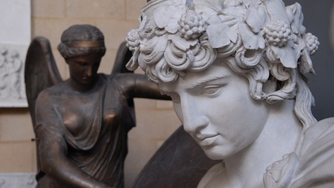 Sculpted head of Antinous, with bronzed winged Nike behind