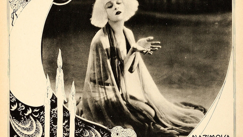 Lobby card for the 1923 film, Salomé. A black and white photograph of a blonde woman, overlaid with an illustrated woman and text that says 'Nazimova in Salomé'