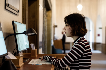 Student on a computer at the University Library 