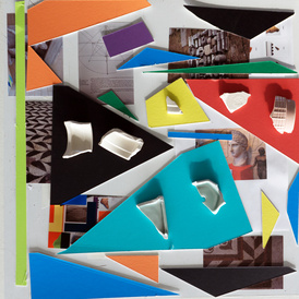 Colourful mountboard in geometric sherds, interspersed with photographs and pottery sherds