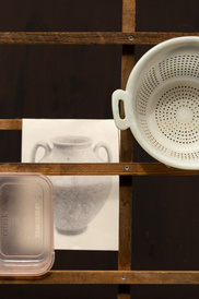 Artwork comprising drawing of Greek pot and household items on wooden frame