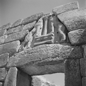 View of triangular relief with lions set above a gateway, black and white photograph