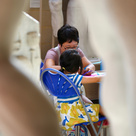 Mother and child do craft activity in museum