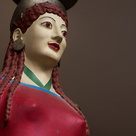 Painted face of the Peplos Kore, with red lips and eyes