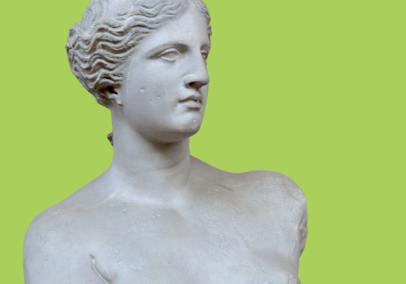 female statue against blue background
