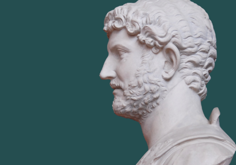 sculpted head of the emperor Hadrian, a bearded man looking to the left