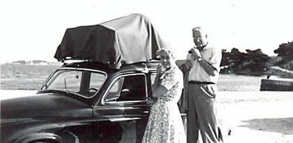 black and white photo of George Bean and his wife in front of a car
