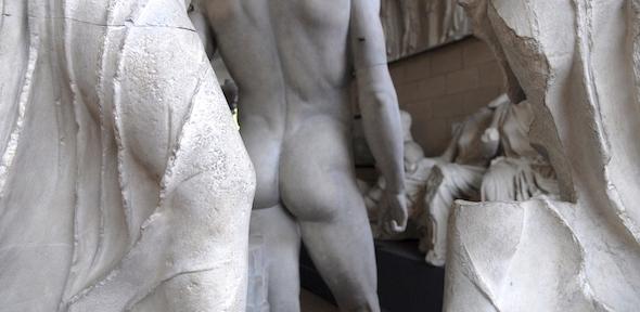 None Rear of a naked male statue and Parthenon pedimental sculpture