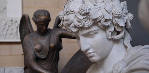 Sculpted head of Antinous, with bronzed winged Nike behind