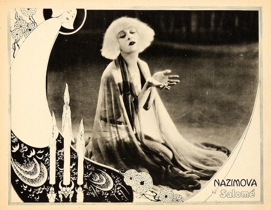 Lobby card for the 1923 film, Salomé. A black and white photograph of a blonde woman, overlaid with an illustrated woman and text that says 'Nazimova in Salomé'