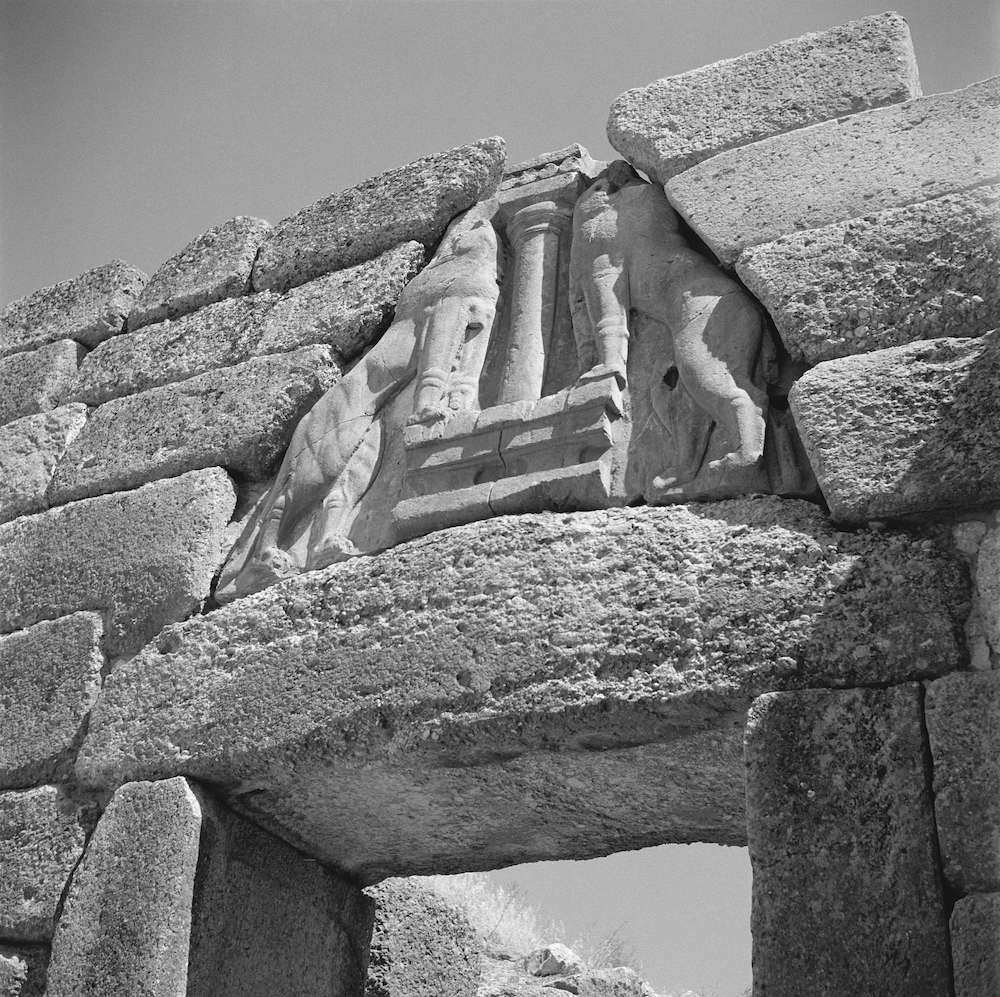 View of triangular relief with lions set above a gateway, black and white photograph